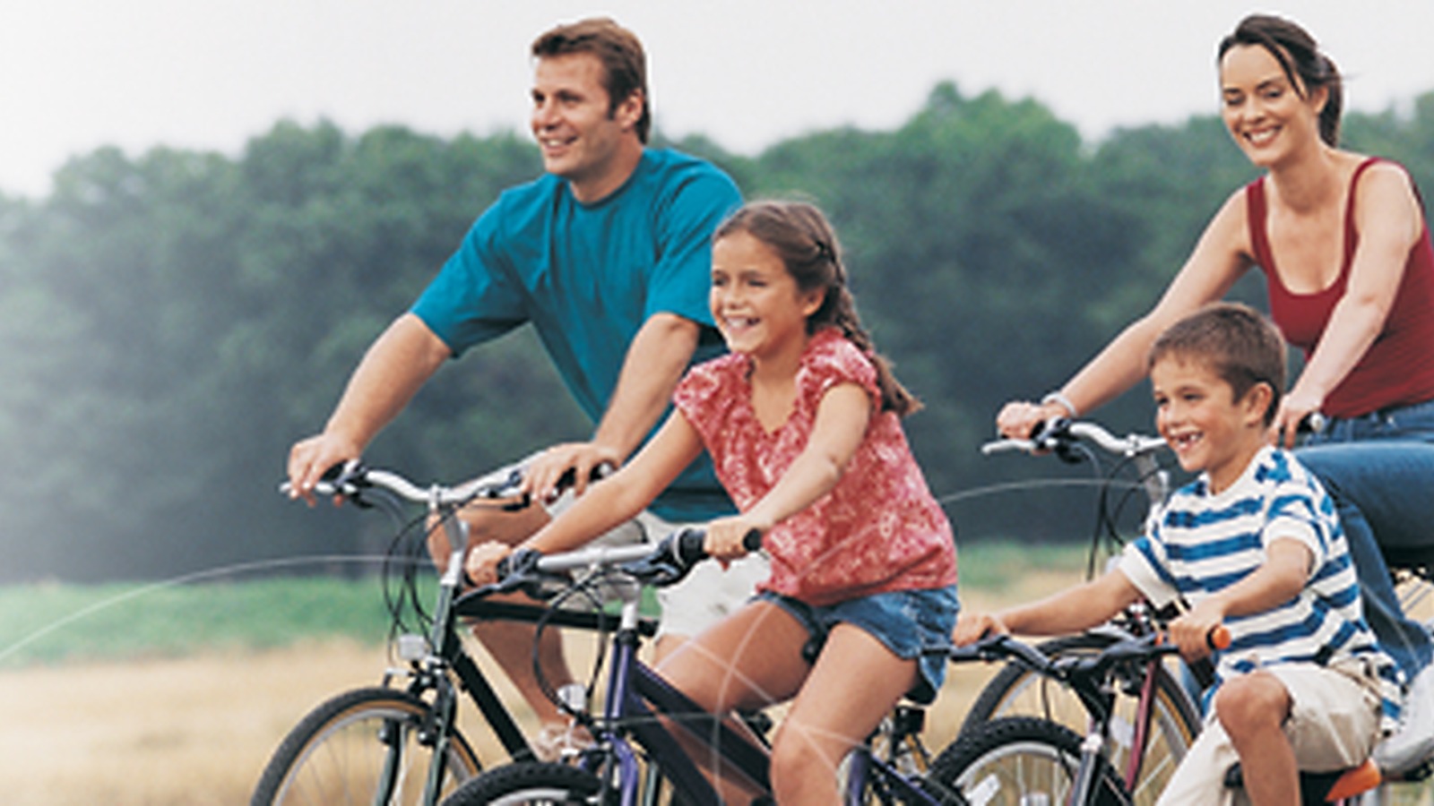 Family riding bicycles outdoors